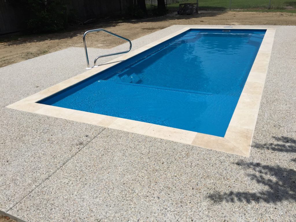 Copano Pools and Spas professional team installing a fiberglass shell